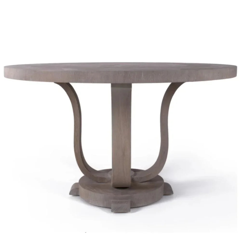 Round wooden dining table with curved pedestal base in farmhouse style