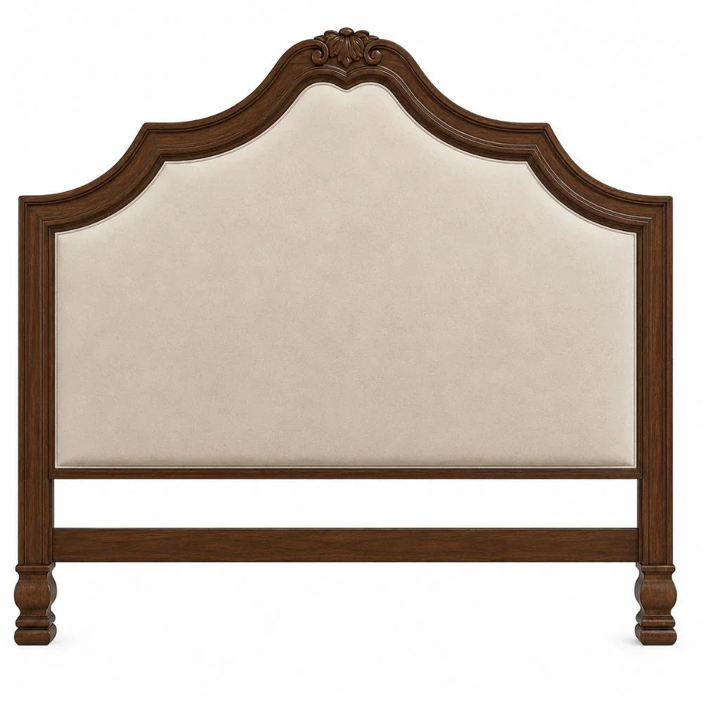 French country wooden headboard with cream upholstery and carved details