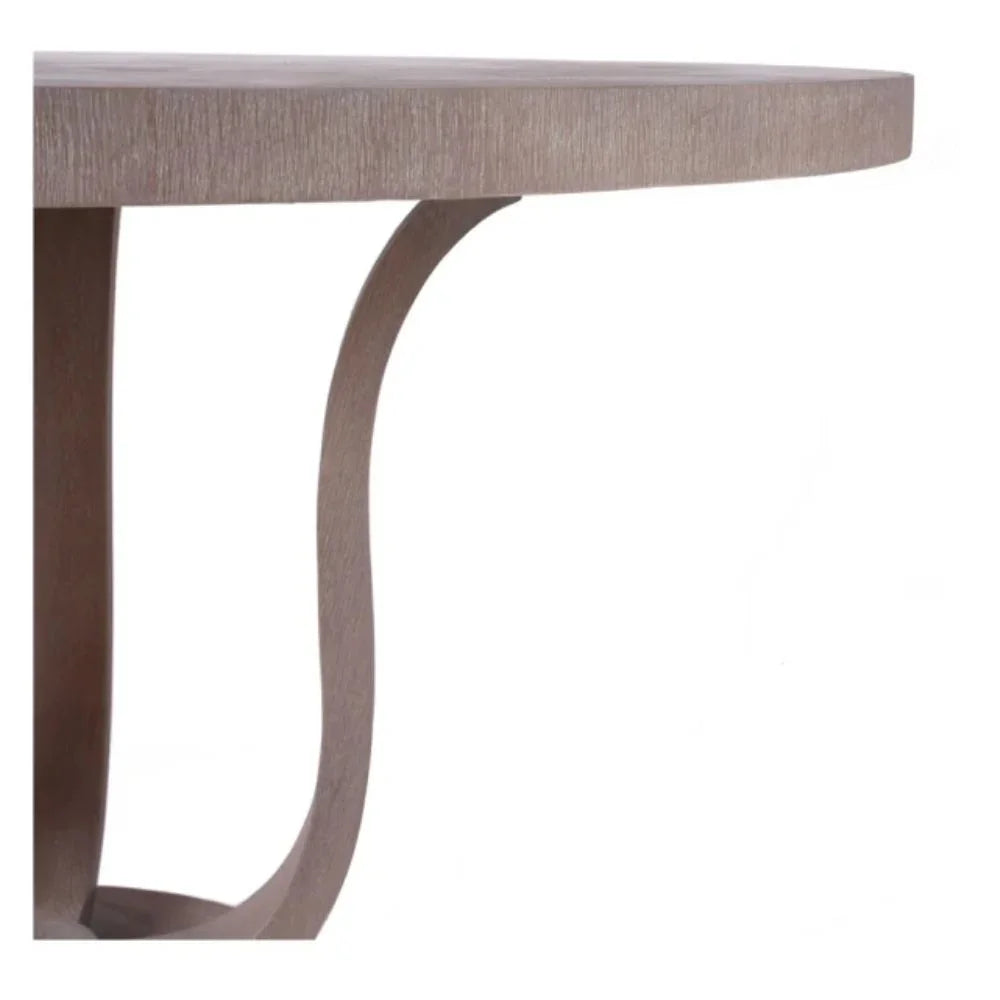 Round wooden side table with curved legs in natural boho farmhouse style