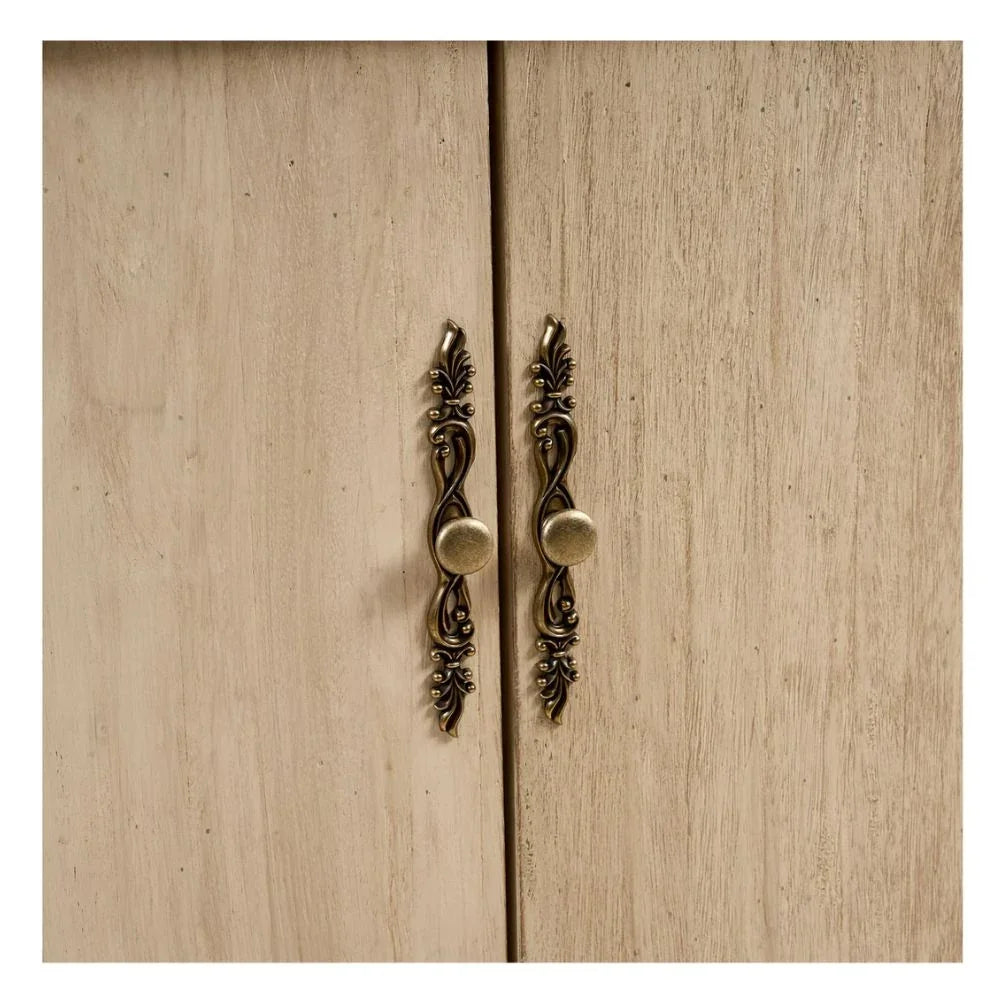 Ornate bronze cabinet handles on light wood doors, French country style hardware