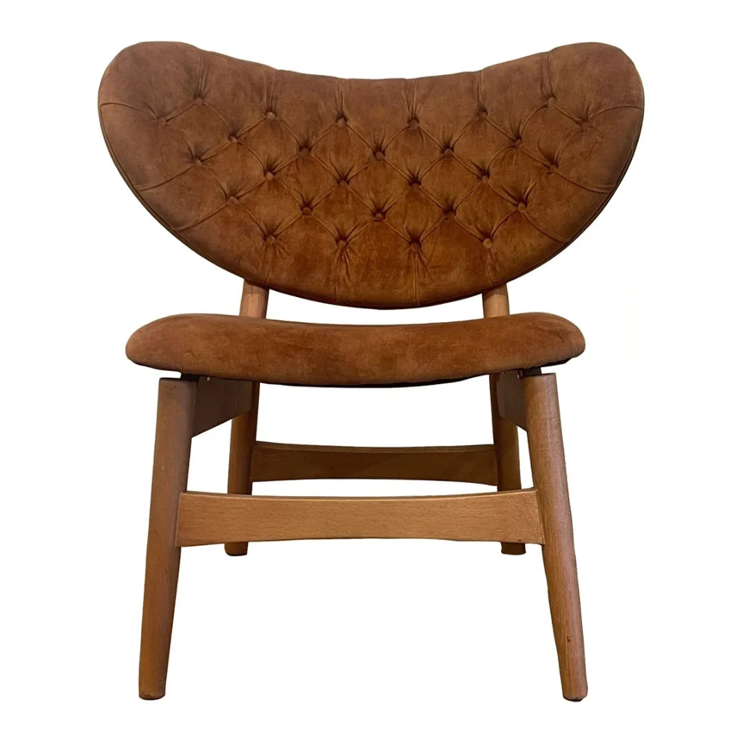 Brown tufted leather chair with wooden legs, mid-century modern design for cozy living room seating