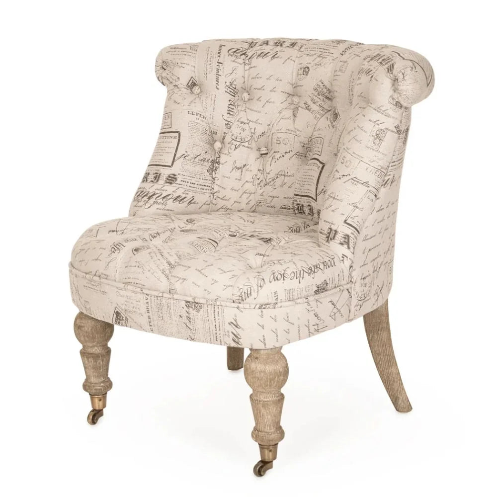 French country tufted armchair with script print fabric and turned wooden legs