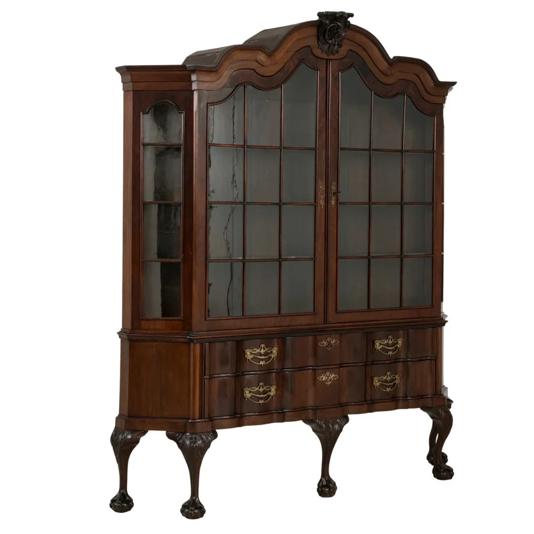 Elegant French country hutch with glass doors, ornate carvings, and clawfoot legs for vintage charm