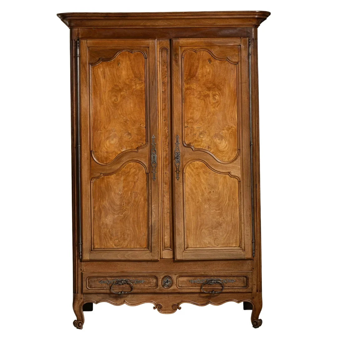 French country armoire with ornate wood grain and vintage hardware