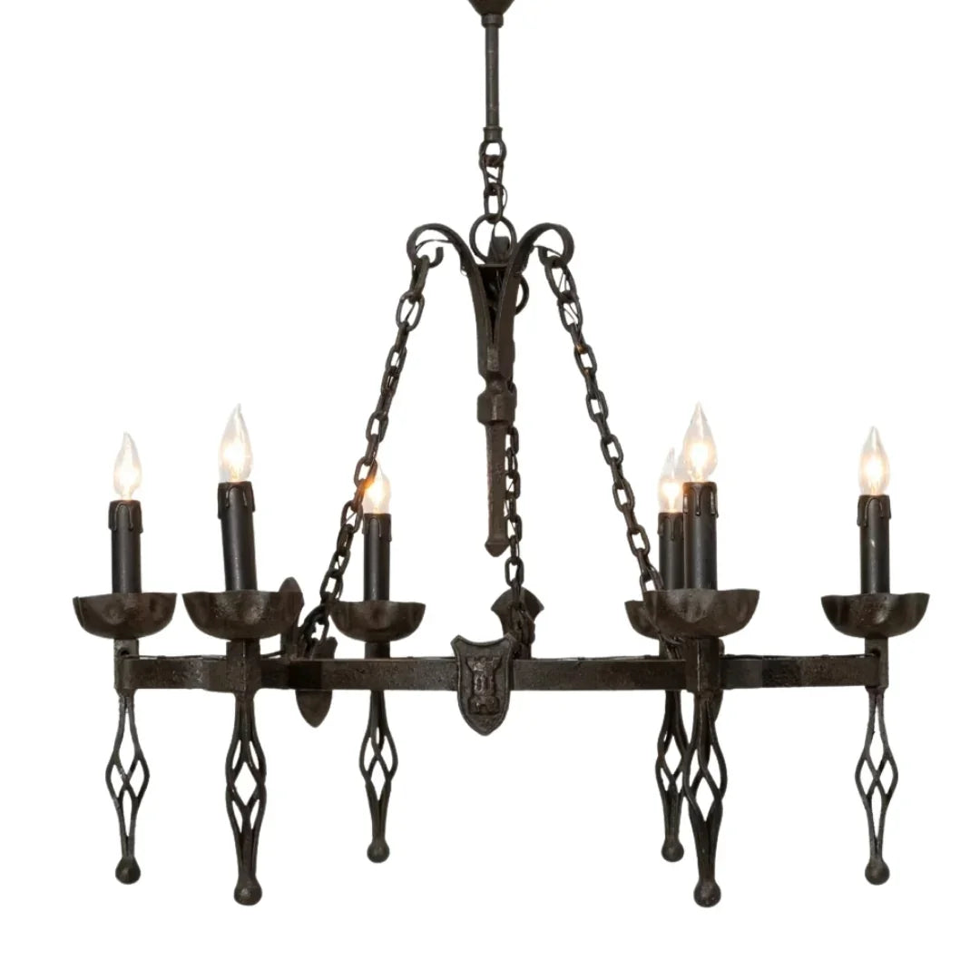Rustic wrought iron chandelier with candle-style bulbs, perfect for French country or farmhouse decor