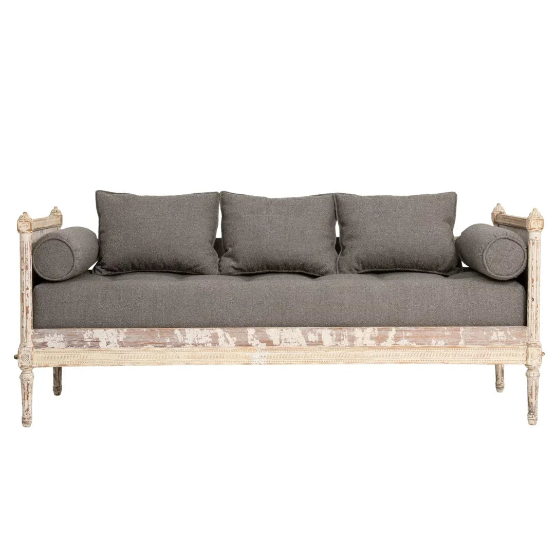 Shabby chic sofa with distressed white frame and gray cushions