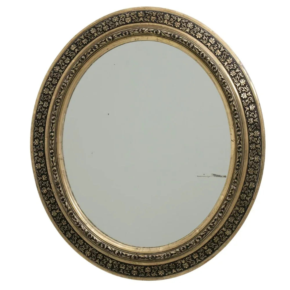 Ornate oval mirror with intricate floral detailing, perfect for French country or shabby chic decor
