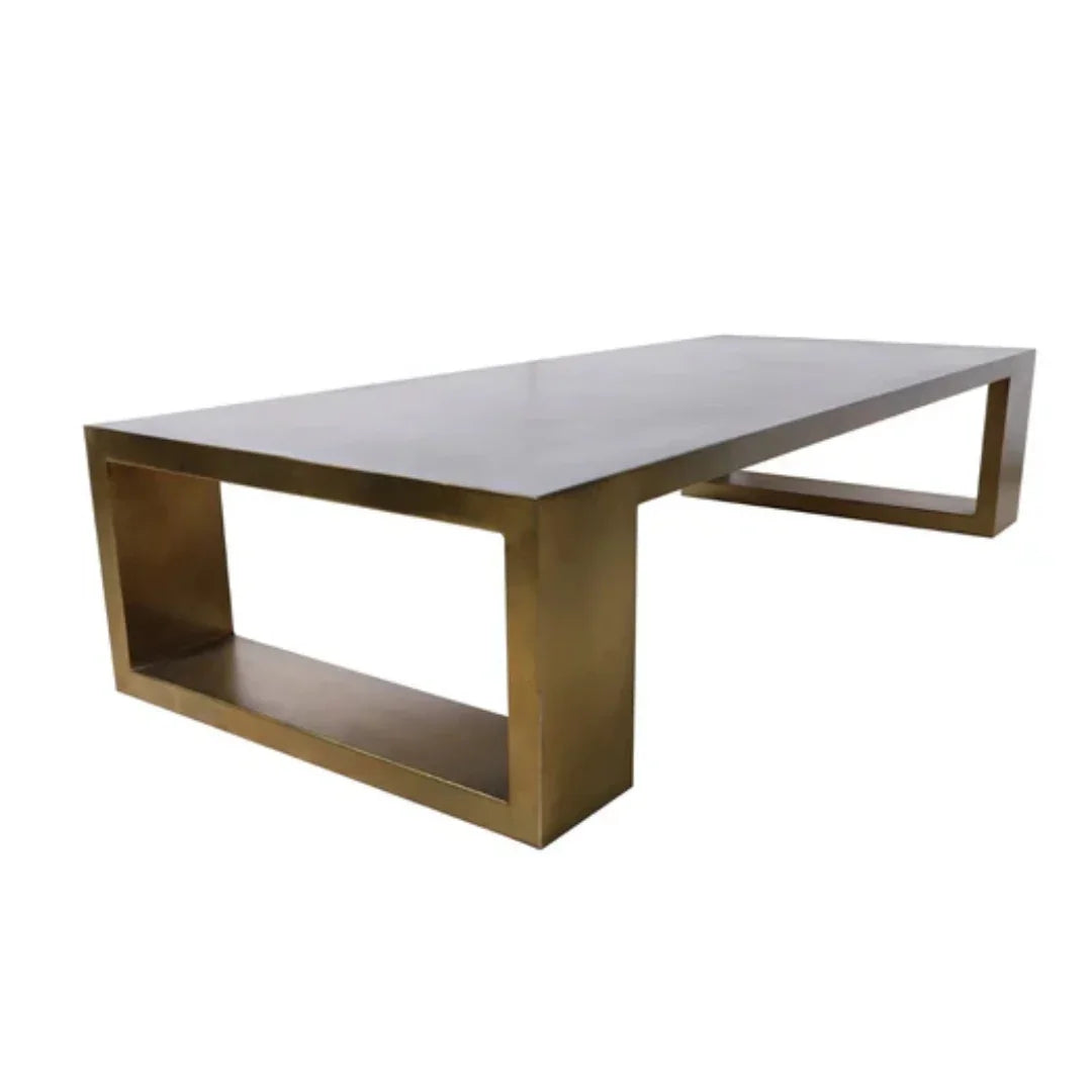 Modern brass coffee table with minimalist design and lower shelf, perfect for contemporary living rooms.