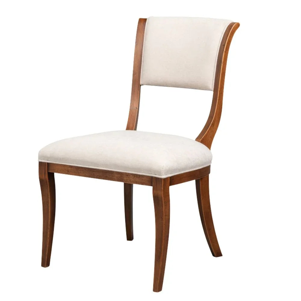 Elegant French country dining chair with curved wood frame and cream upholstery, perfect for farmhouse or shabby chic decor.