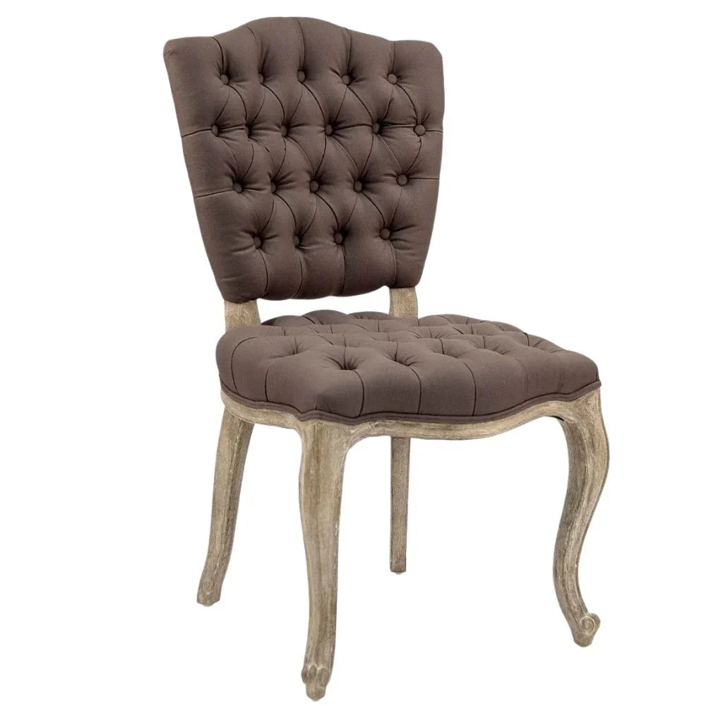 Brown tufted dining chair with distressed wood legs, French country style