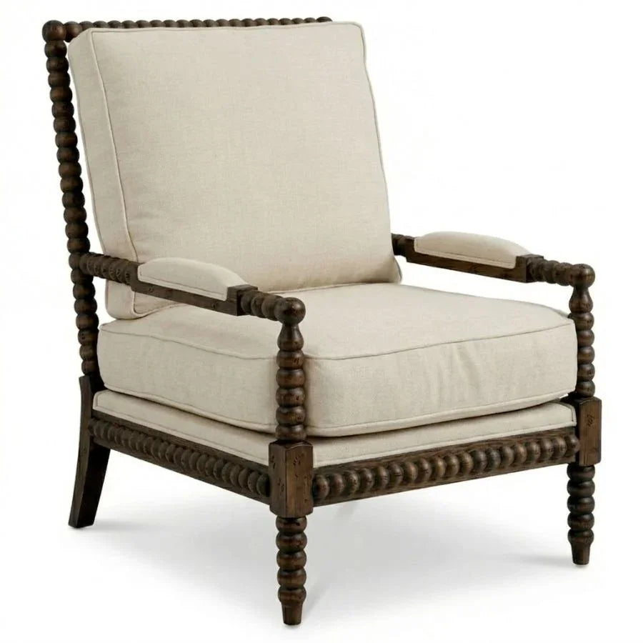 French country armchair with turned wood frame and neutral linen upholstery, ideal for farmhouse or shabby chic decor