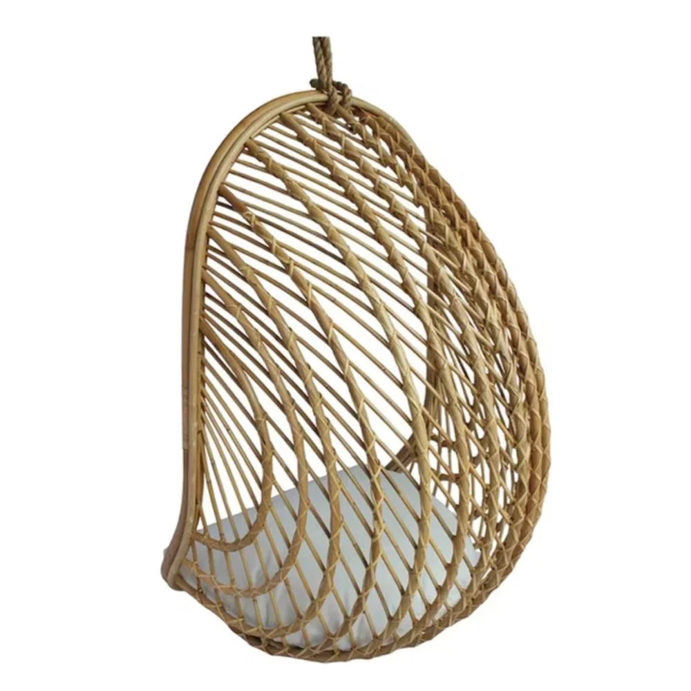 Natural rattan hanging egg chair with white cushion, boho coastal style seating