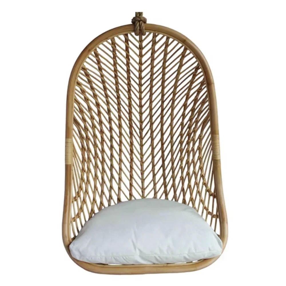 Natural boho rattan hanging chair with white cushion, perfect for coastal or farmhouse decor