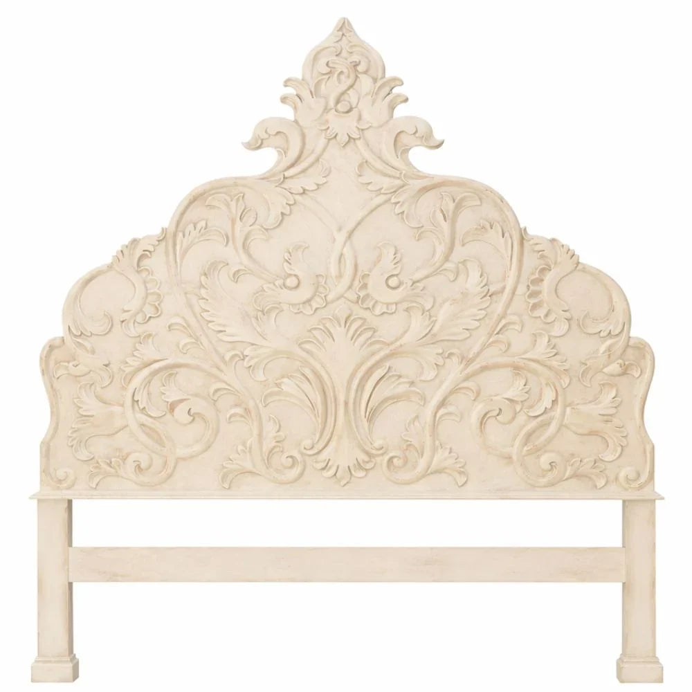 Ornate French country headboard with carved floral details in shabby chic cream finish