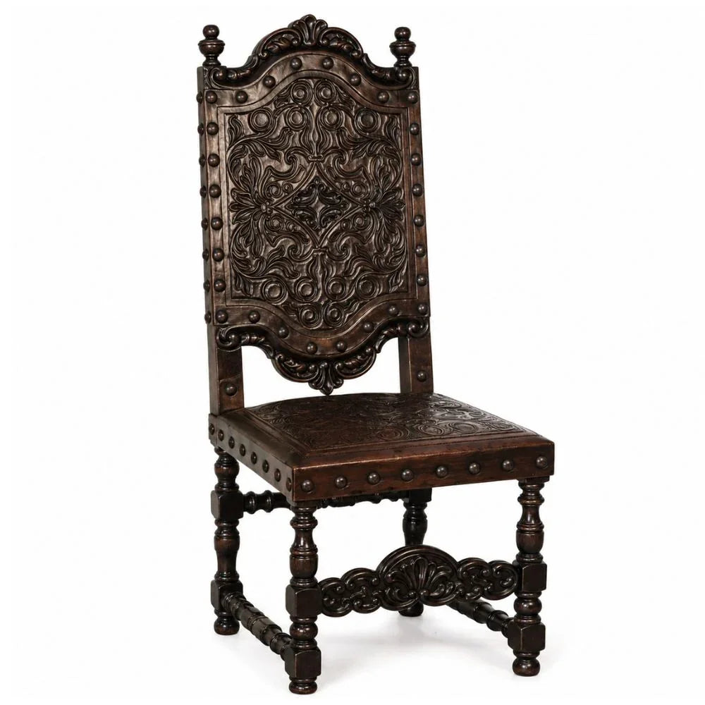 Antique carved wooden chair with ornate floral details and nailhead trim, French country style