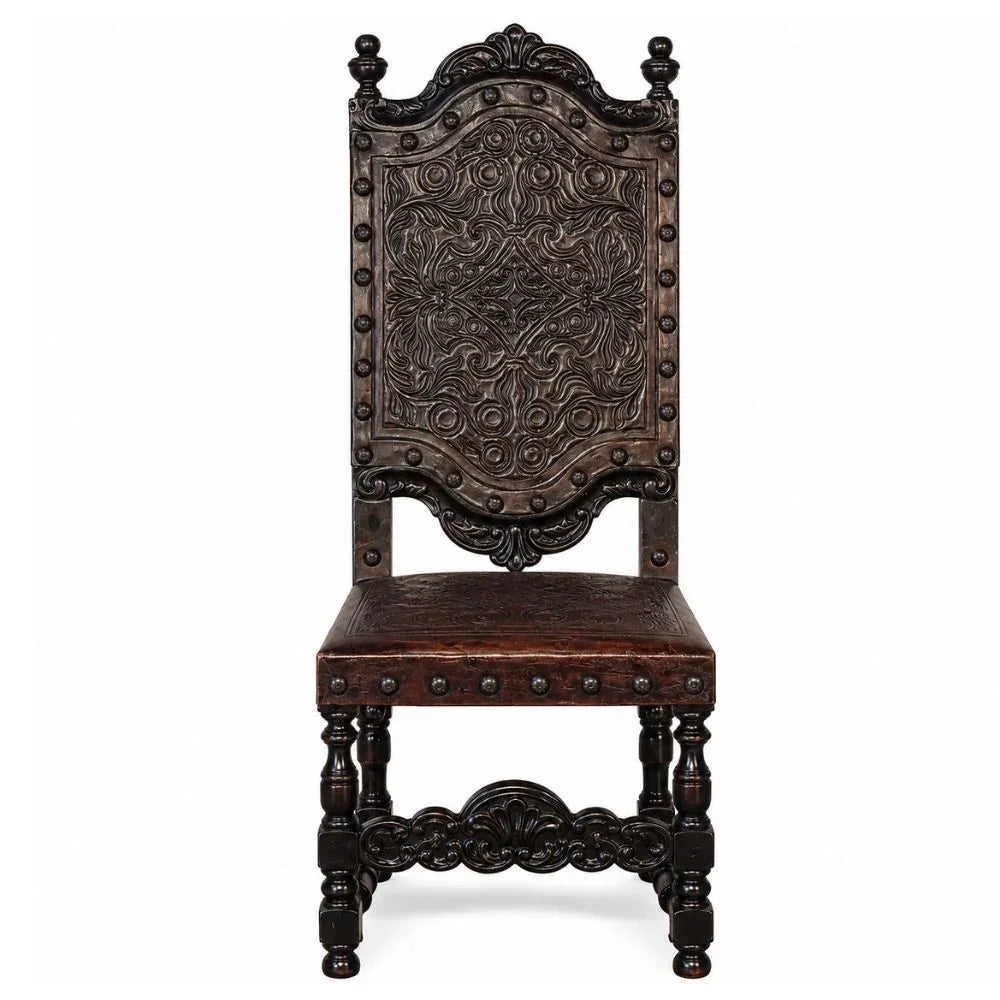 Ornate dark wood dining chair with carved floral back and nailhead trim, French country style