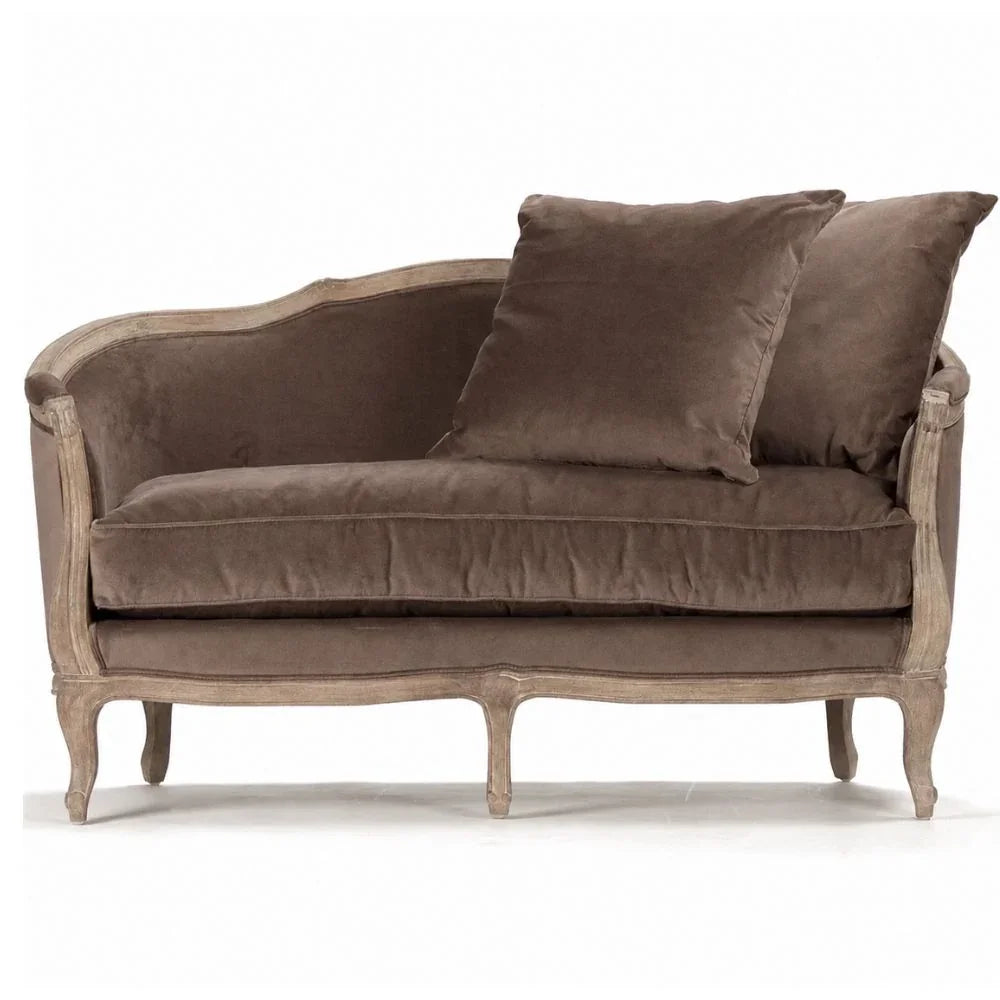 French country chaise lounge with velvet upholstery and distressed wood frame