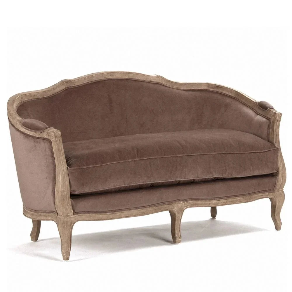 Elegant French country sofa with velvet upholstery and curved wooden frame