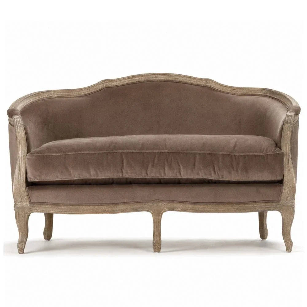 French country velvet loveseat with distressed wood frame and curved back