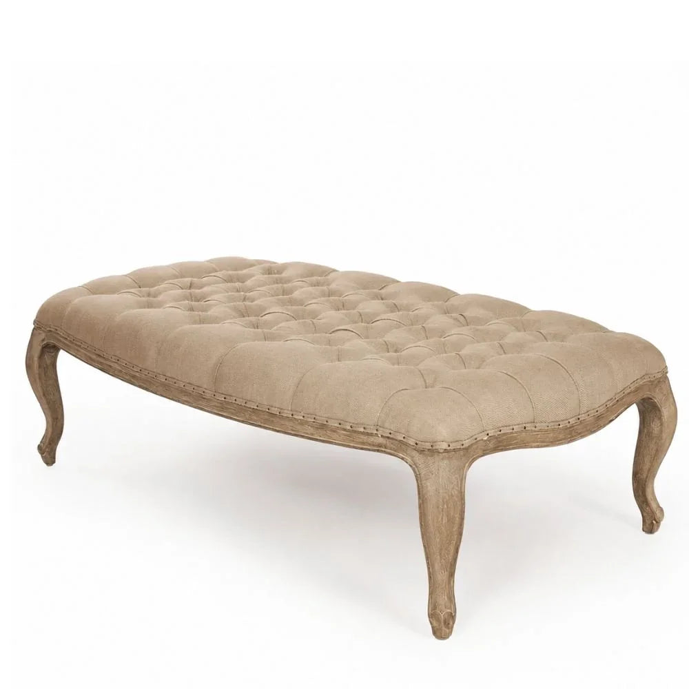 Tufted beige ottoman with curved legs in French country style