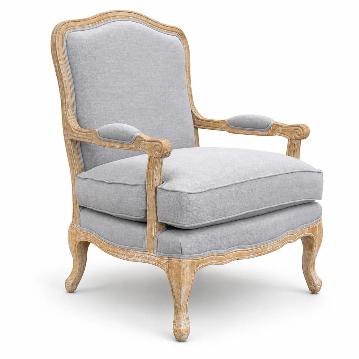 Dove Mist linen upholstered armchair with carved oak frame, curved arms, distressed finish, and plush gray seat cushion.