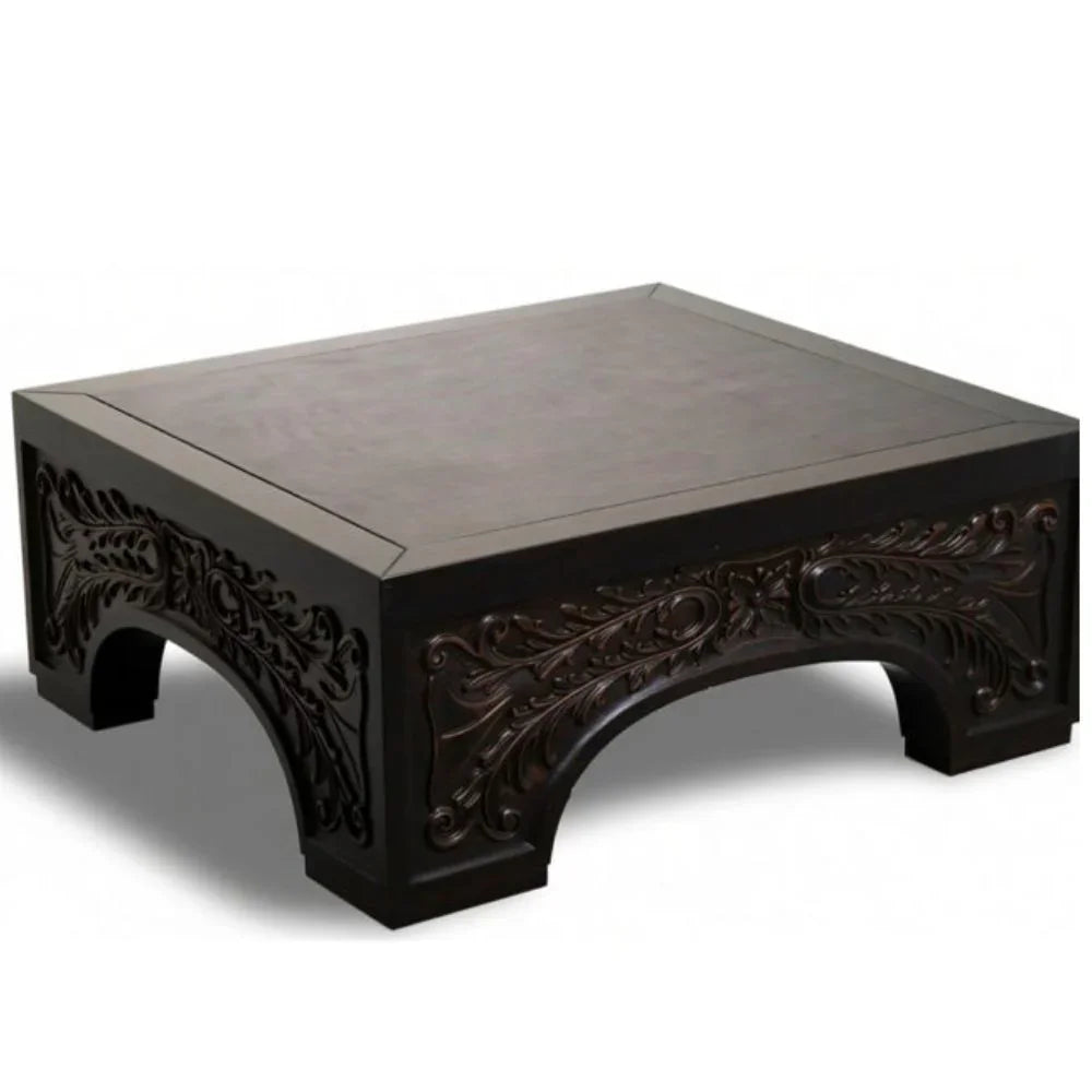 Dark wood coffee table with ornate floral carvings, French country style