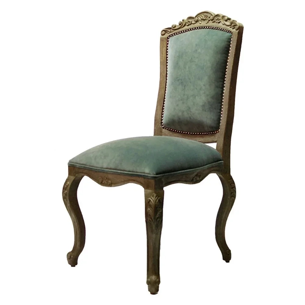 Elegant French country dining chair with teal velvet upholstery and ornate carved wood frame