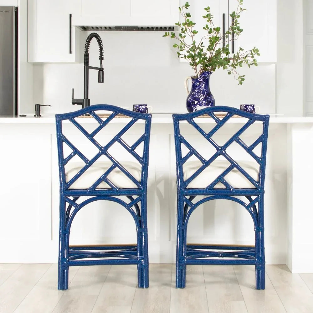 Blue rattan bar stools with white cushions in modern kitchen, coastal farmhouse style