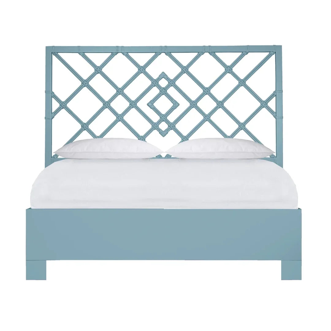 Coastal-style blue lattice bed frame with white bedding