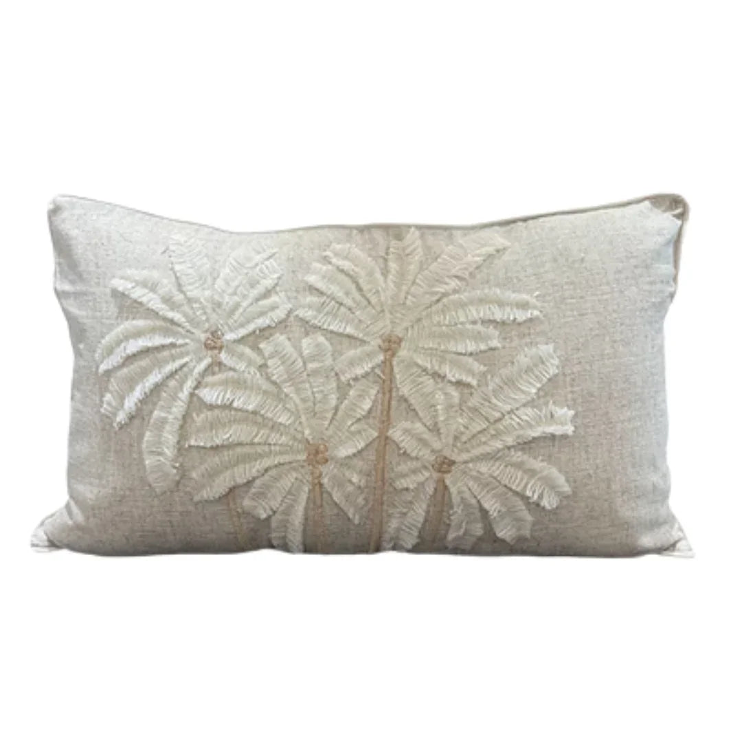 Coastal-style lumbar pillow with embroidered palm trees, natural linen texture, boho chic decor accent