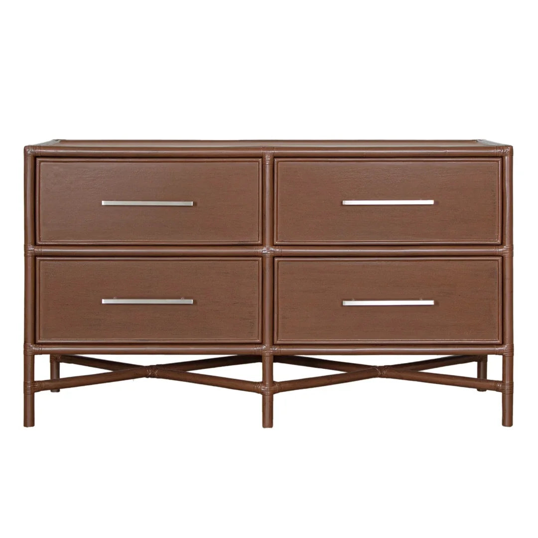 Brown rattan dresser with four drawers and sleek metal handles, perfect for coastal or boho decor.