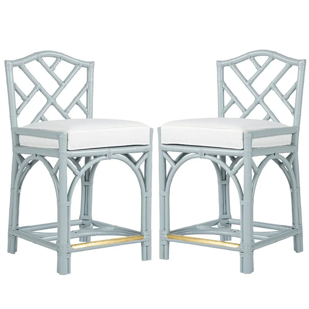 Light blue rattan bar stools with white cushions and gold accents, coastal farmhouse style