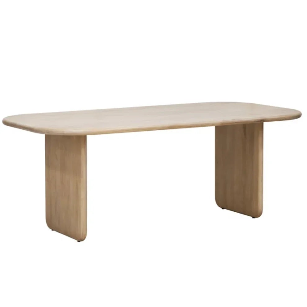 Natural wood dining table with minimalist design, ideal for farmhouse or coastal style interiors.