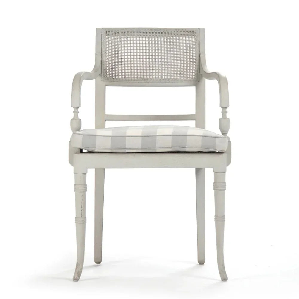 Elegant French country armchair with cane back and checkered cushion, perfect for shabby chic decor