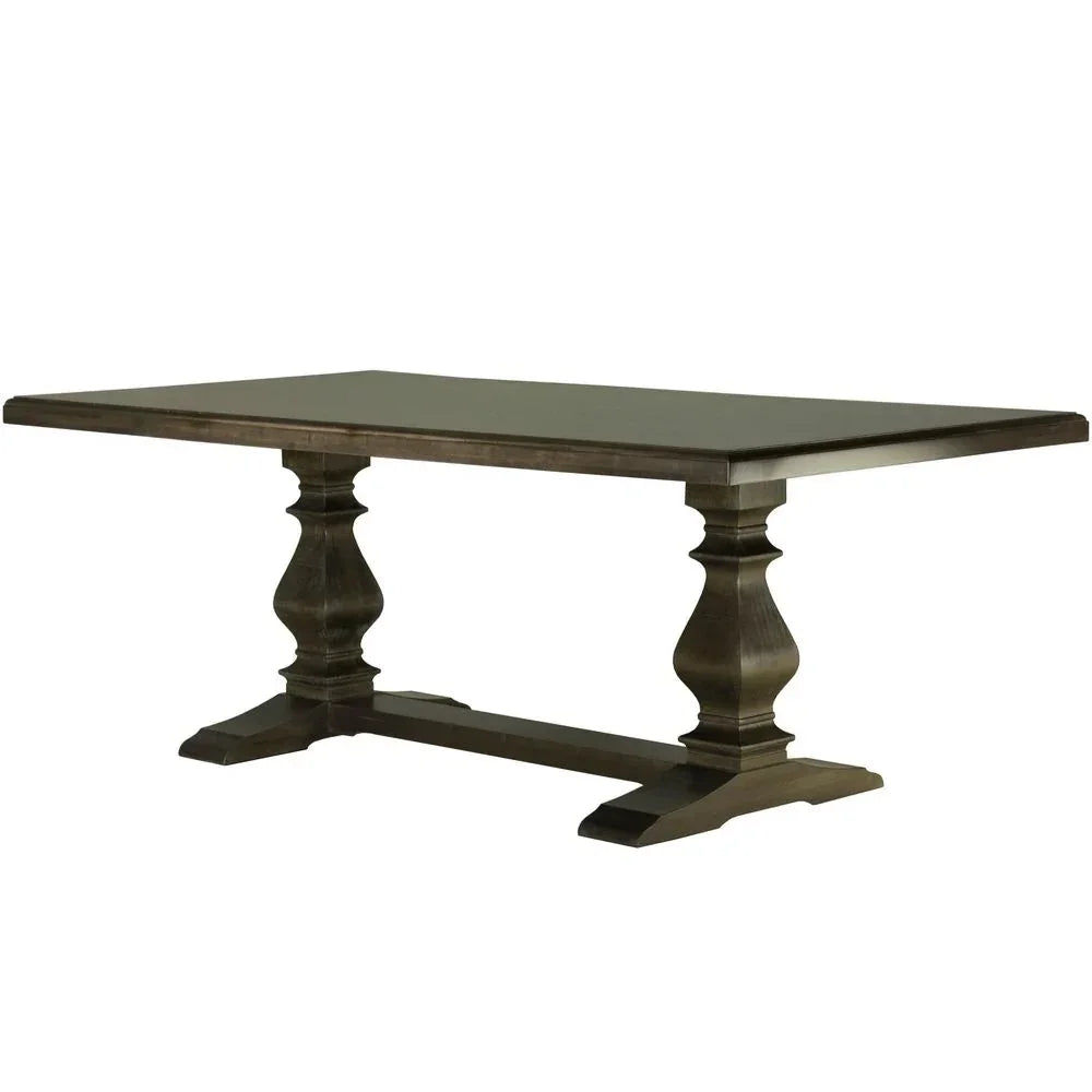 Rustic farmhouse dining table with turned pedestal legs and dark wood finish