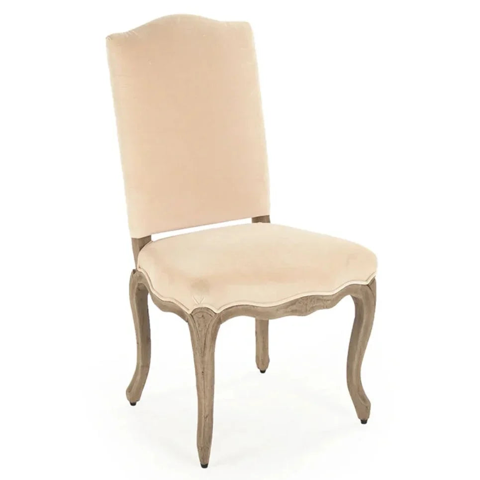 Elegant French country dining chair with beige velvet upholstery and distressed wood legs