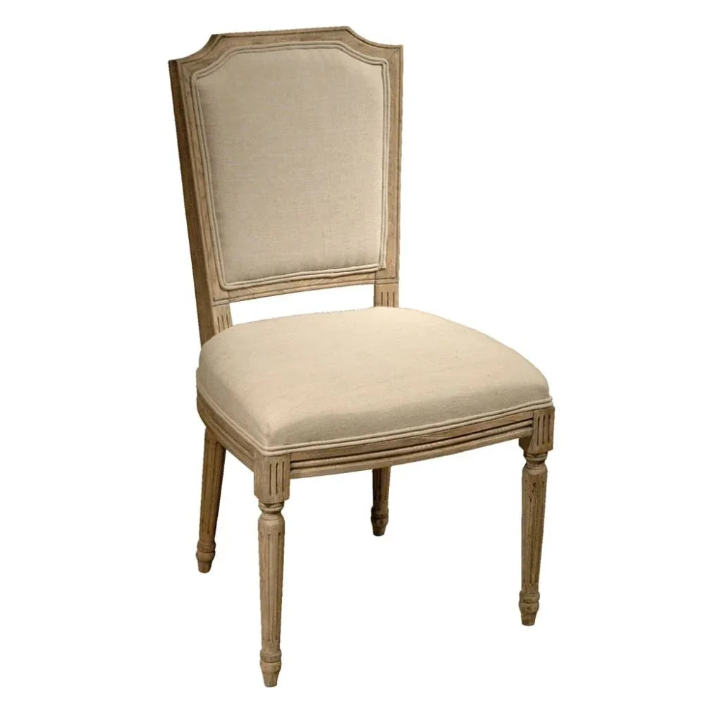 Elegant French country dining chair with beige upholstery and distressed wood finish