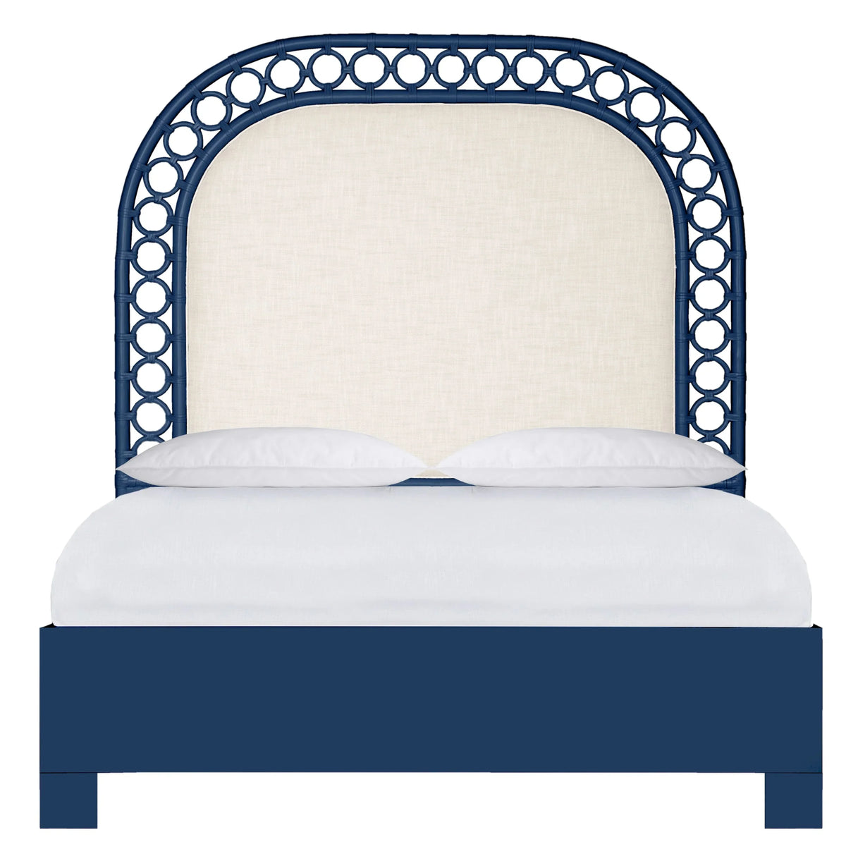 Navy blue coastal style bed with an arched rattan headboard and cream fabric upholstery.