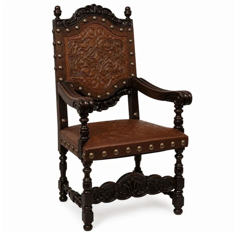 Ornate dark wood armchair with carved leather back and nailhead trim, French country style