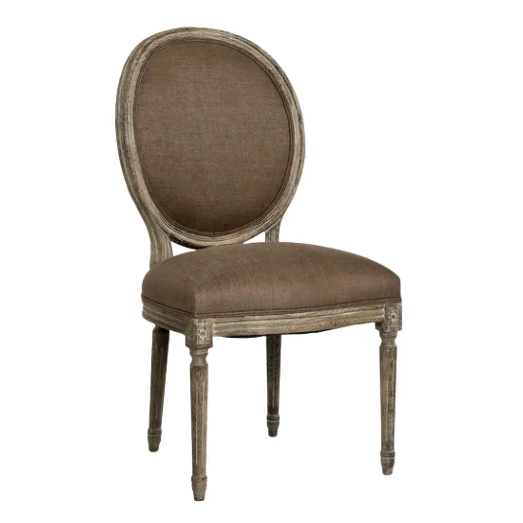 French country dining chair with oval back, distressed wood frame, and taupe upholstery