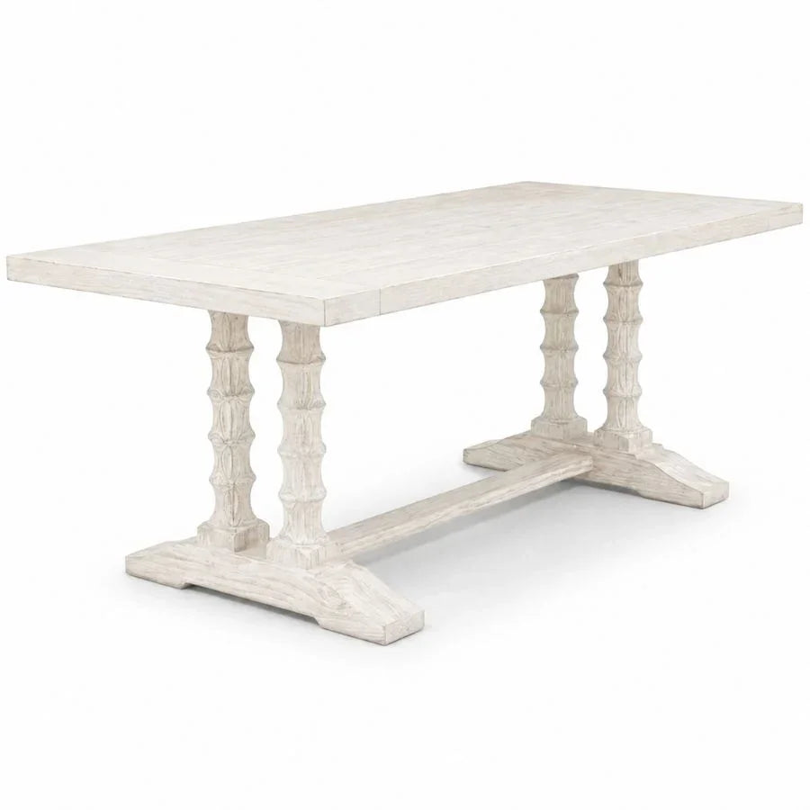 White distressed farmhouse dining table with turned legs, perfect for French country or shabby chic decor
