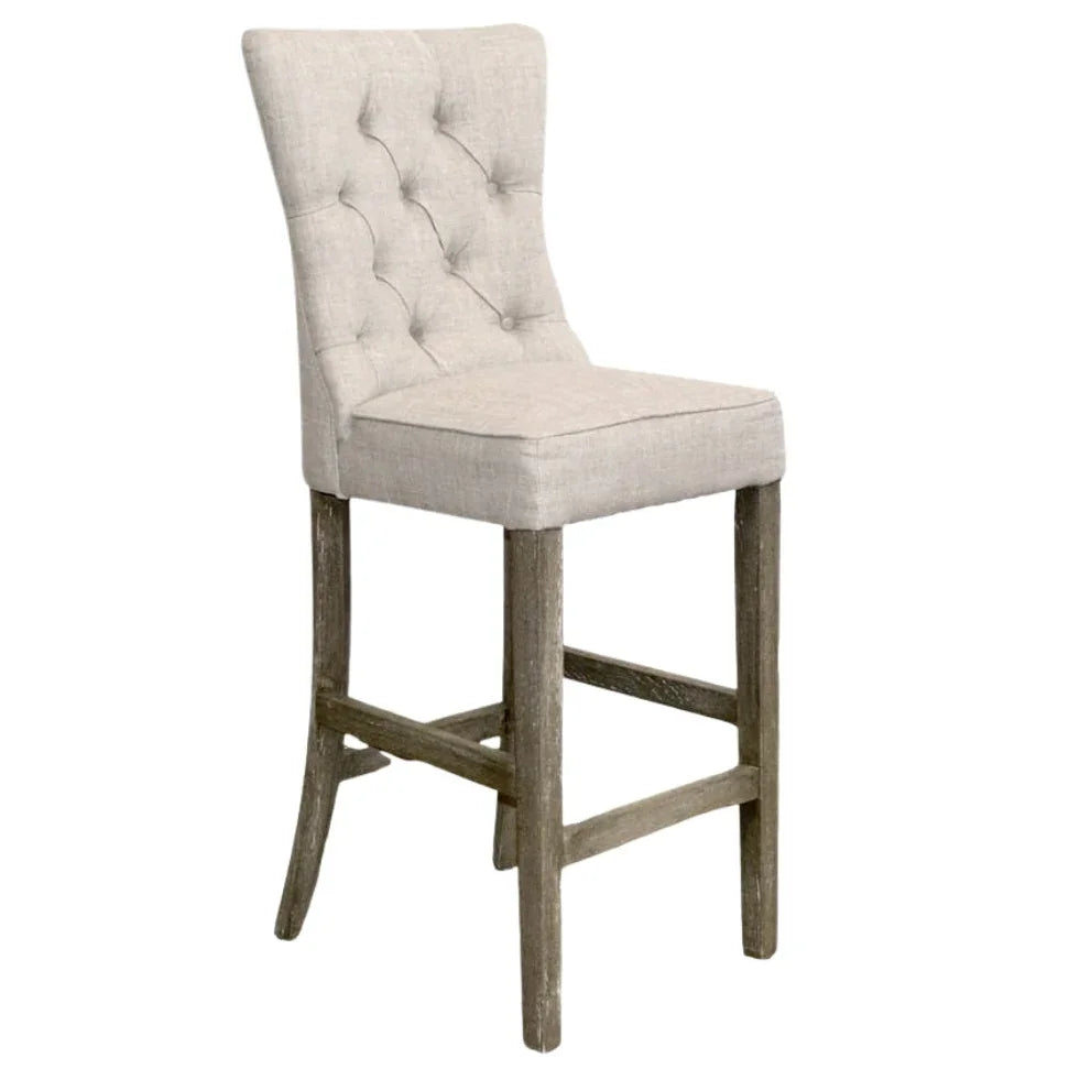 Tufted linen bar stool with rustic wood legs, farmhouse style seating