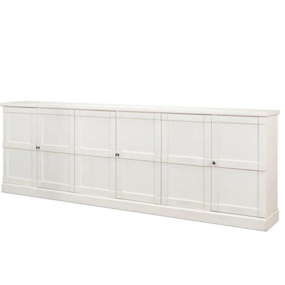 White farmhouse-style sideboard with paneled doors and metal knobs, ideal for coastal or shabby chic decor