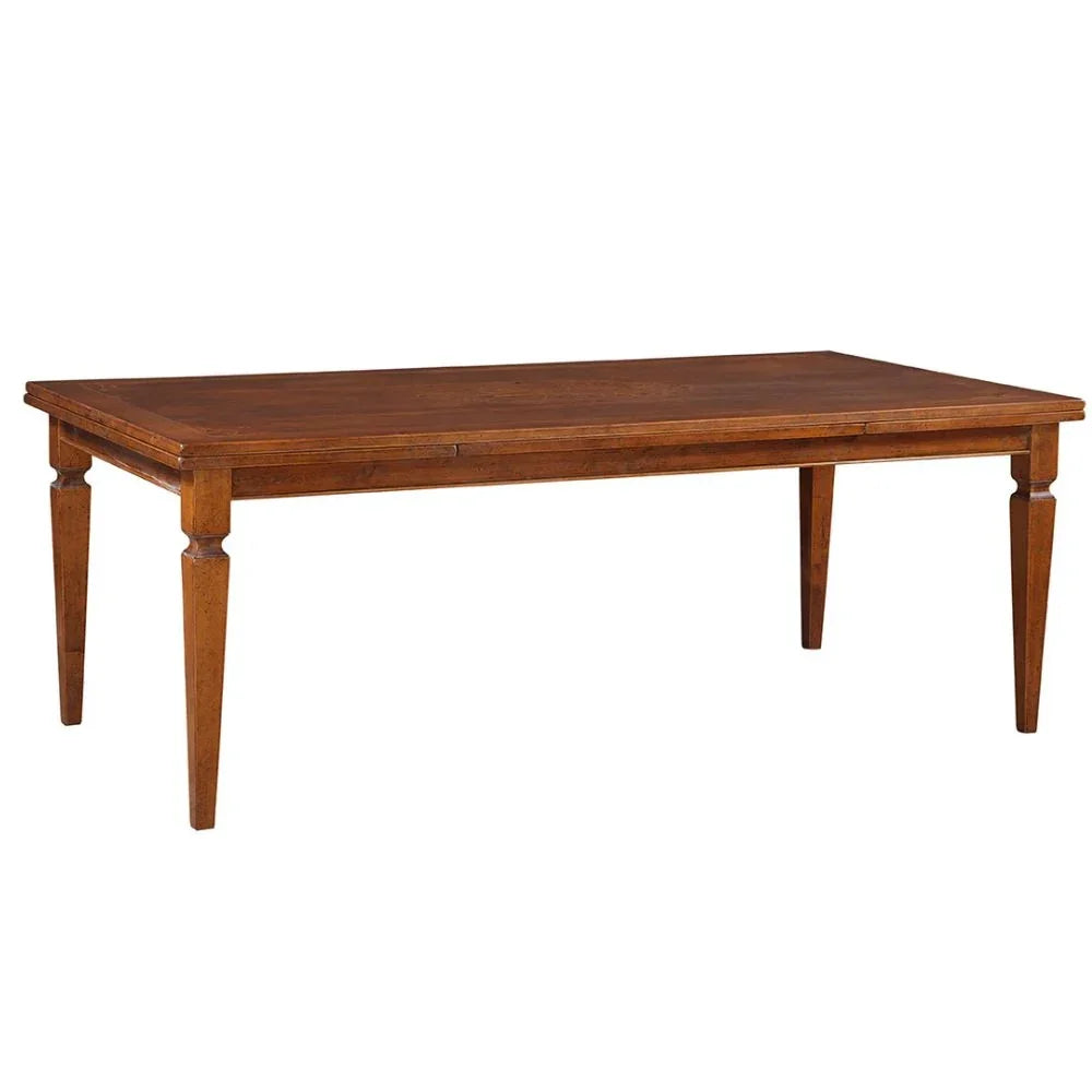 Rustic wooden dining table with turned legs, perfect for farmhouse or French country style homes.