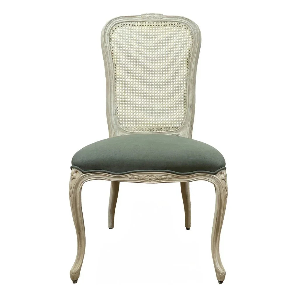 Elegant French country cane back chair with olive green upholstered seat and carved legs