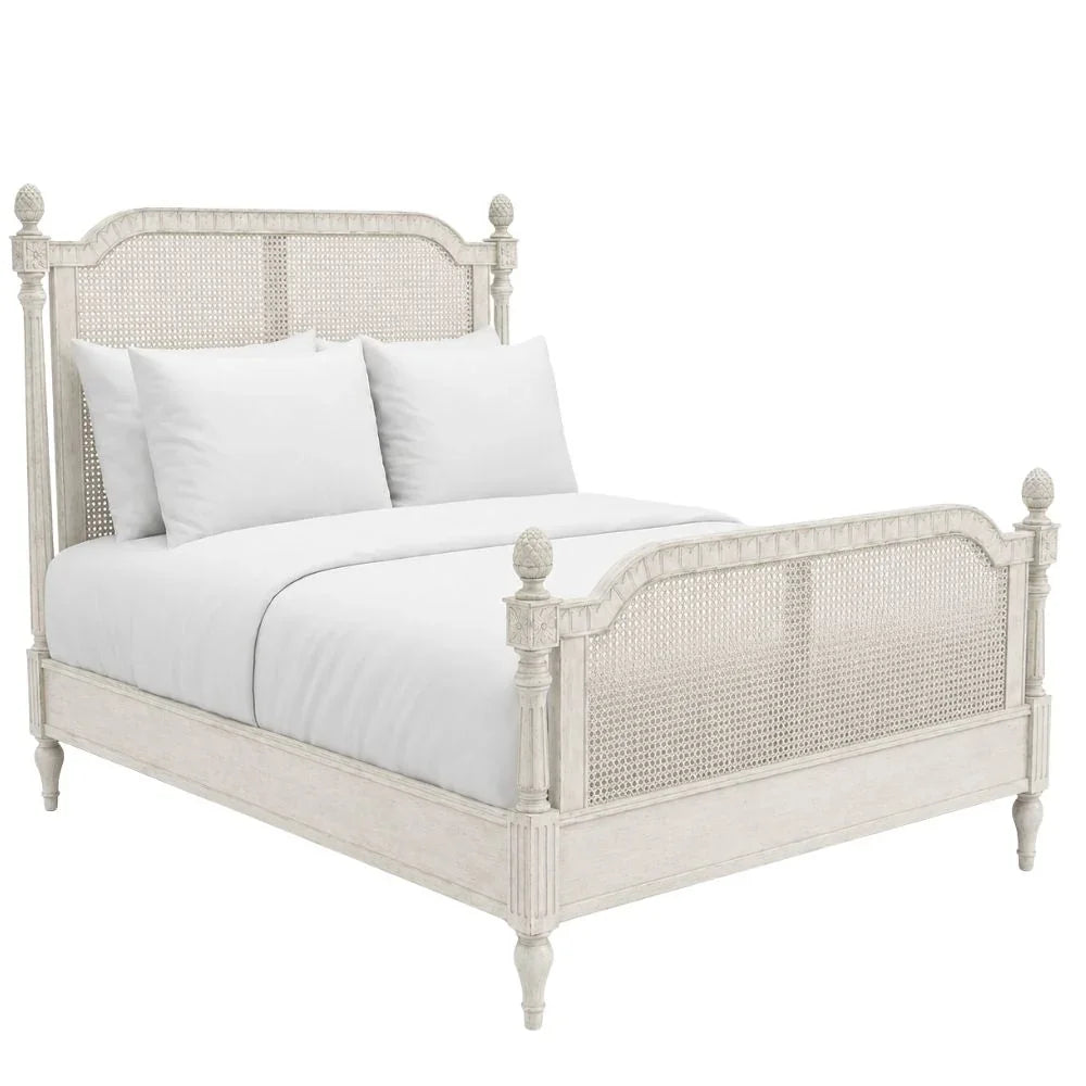 White French country cane bed with turned posts, shabby chic farmhouse style
