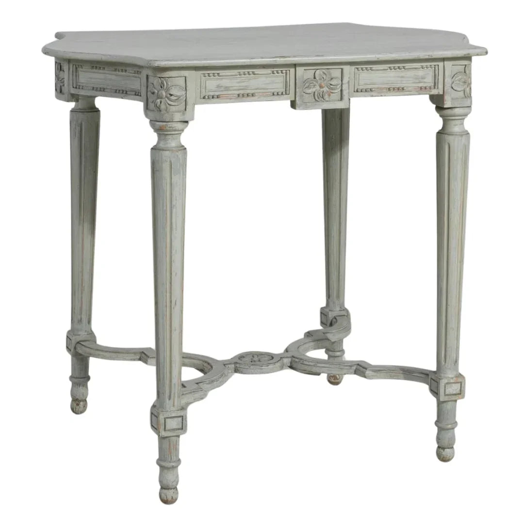 Elegant French country accent table with carved floral details and distressed gray finish