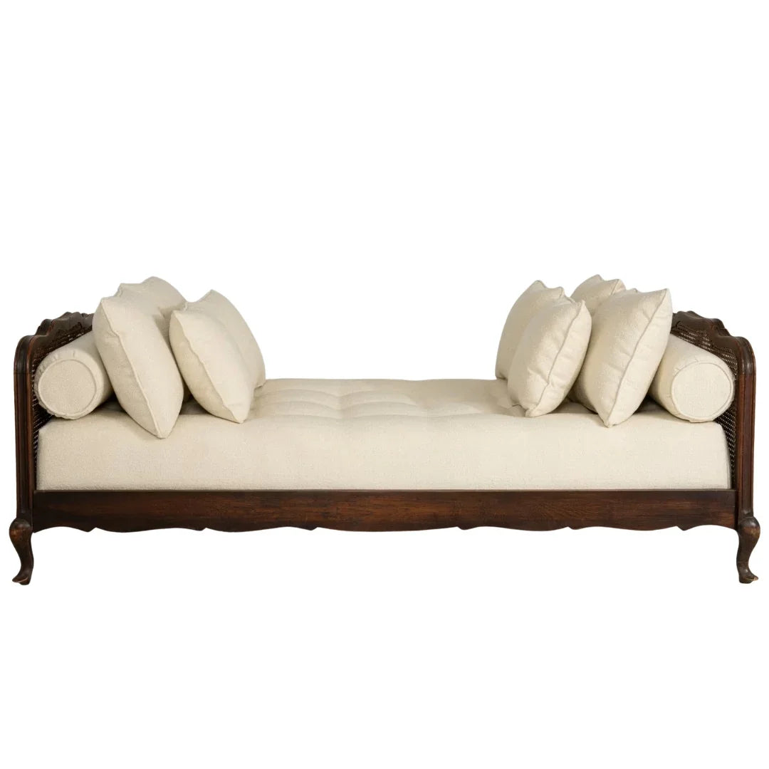Elegant French country chaise lounge with cream cushions and dark wood frame, perfect for shabby chic or farmhouse decor.