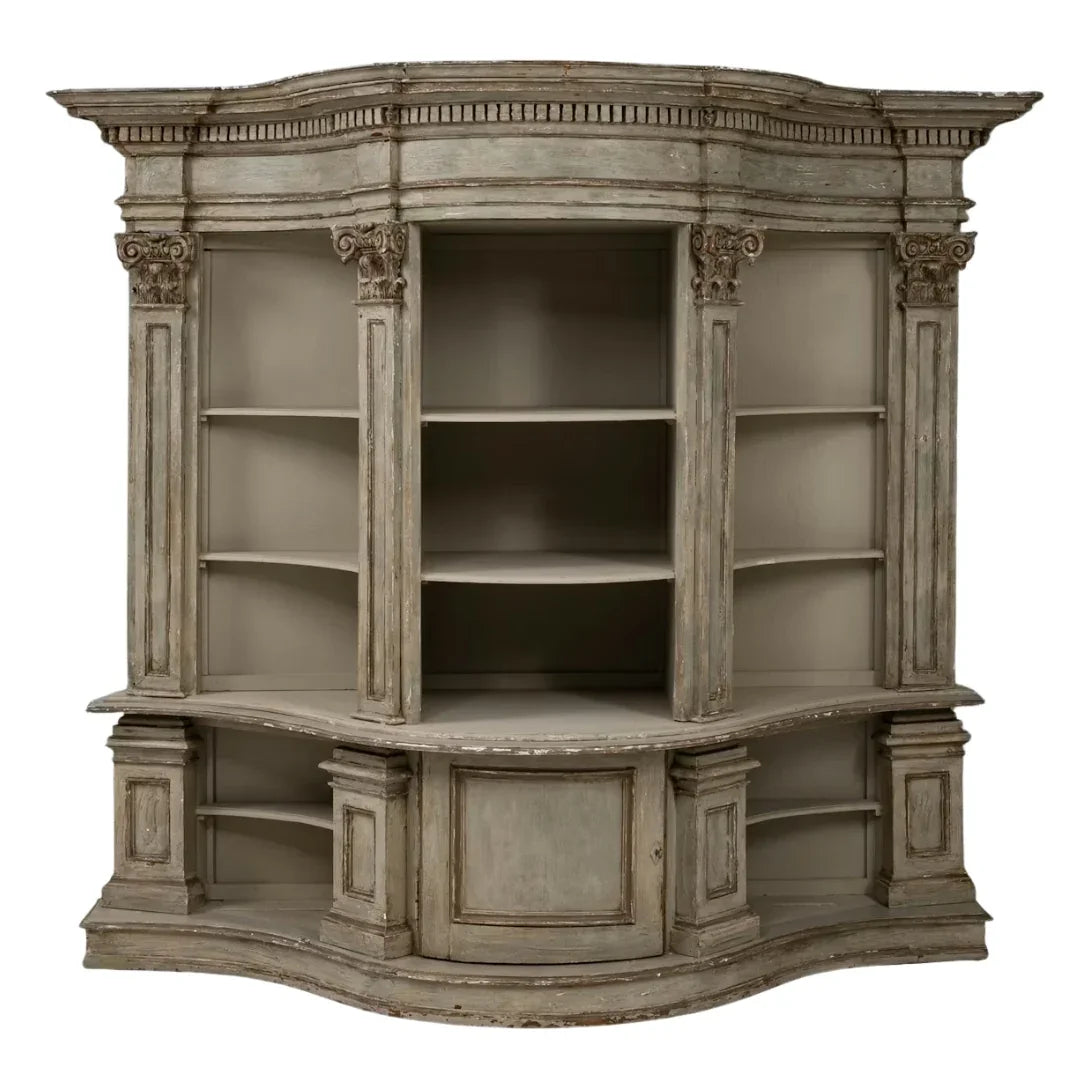 Elegant French country corner bookcase with ornate columns and distressed finish