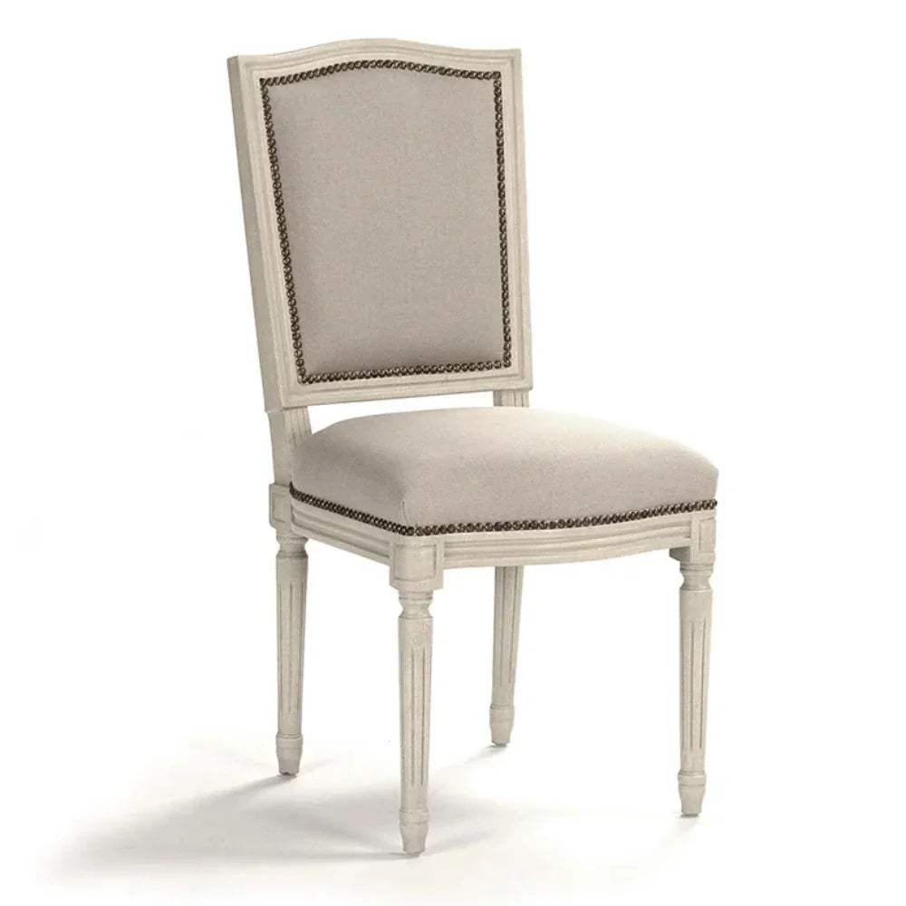 Elegant French country dining chair with nailhead trim and distressed finish, perfect for shabby chic or farmhouse decor.